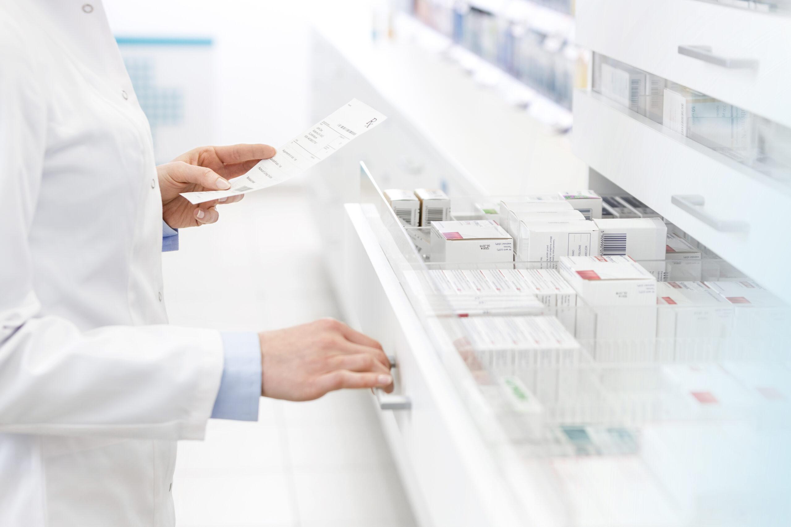 Pharmacist Filling Prescription In Pharmacy