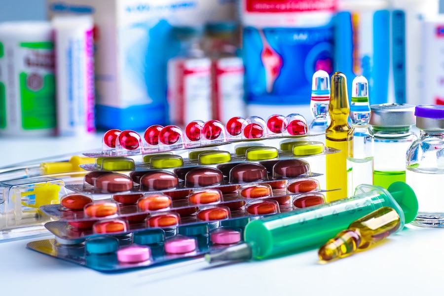 Drug prescription for treatment medication. Pharmaceutical medicament, cure in container for health. Pharmacy theme, capsule pills with medicine antibiotic in packages.