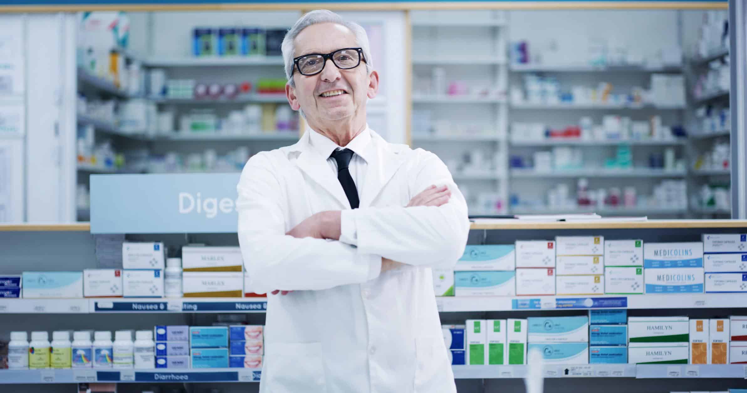 Arms Crossed, Pharmacy And Portrait Of Mature Man In Dispensary For Cure, Treatment Or Vitamins
