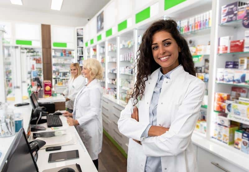 Portrait Of Female Pharmacist In Drugstore